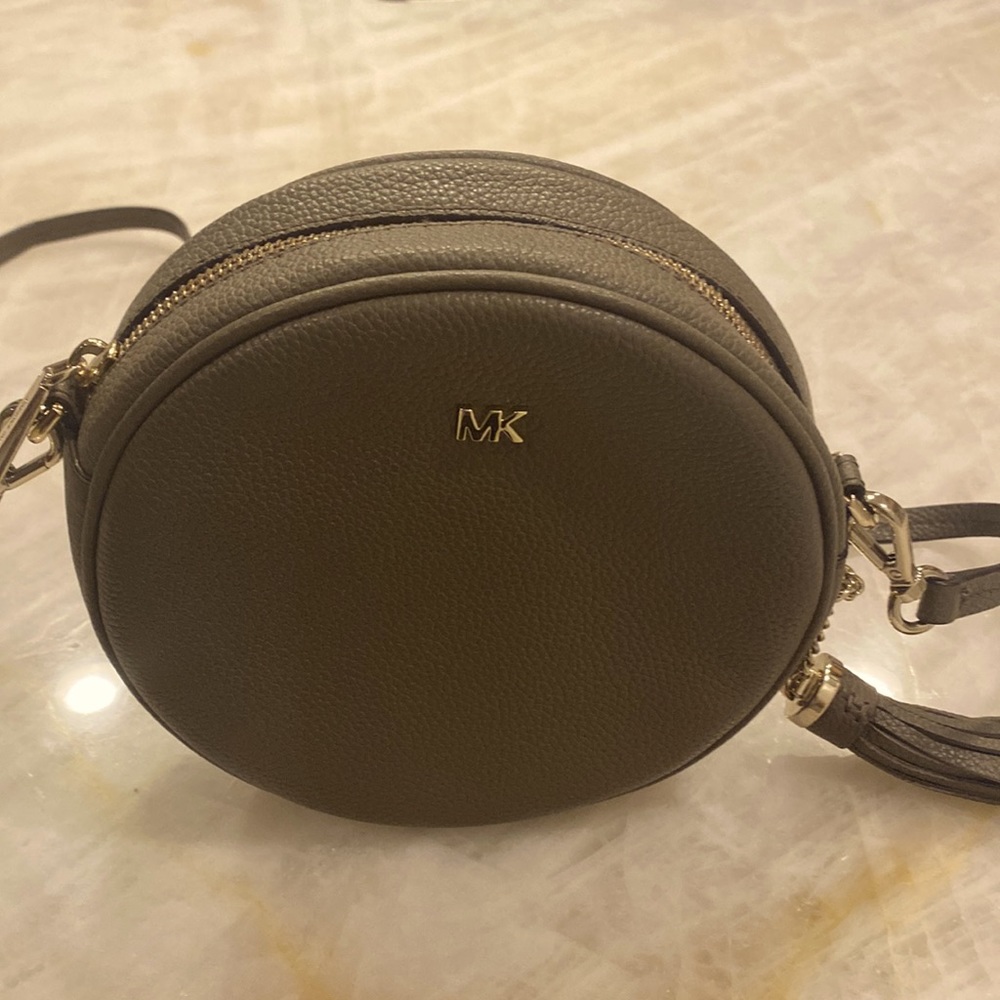 Round Michael Kors crossbody.  Excellent condition. Worn only once. EUC